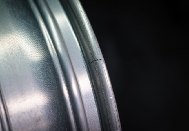 Before and after crack repair on alloy wheel